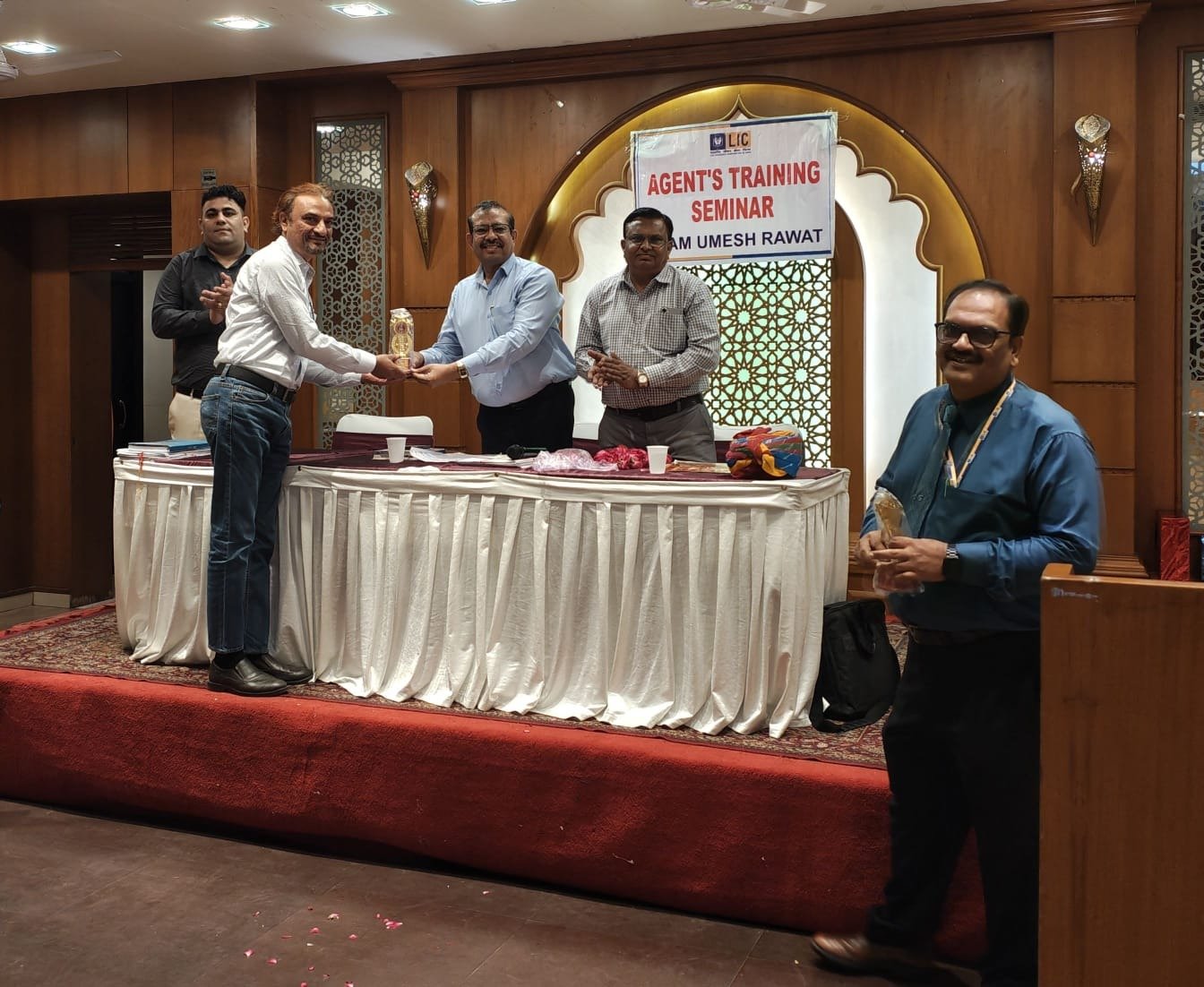 Nadeem Sheikh receiving recognition at a professional event